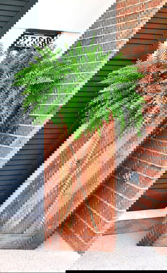 Tall Planters can increase the curb appeal of your home, but they're expensive. How about making them yourself? Begin with these DIY Tall Planter Ideas!